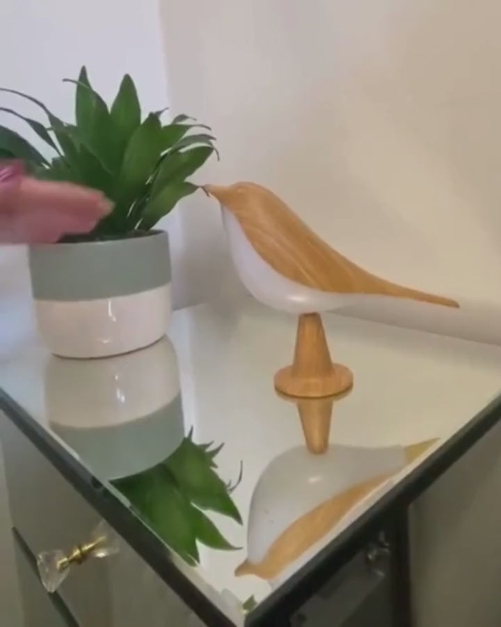 A touch turns the bird lamp on