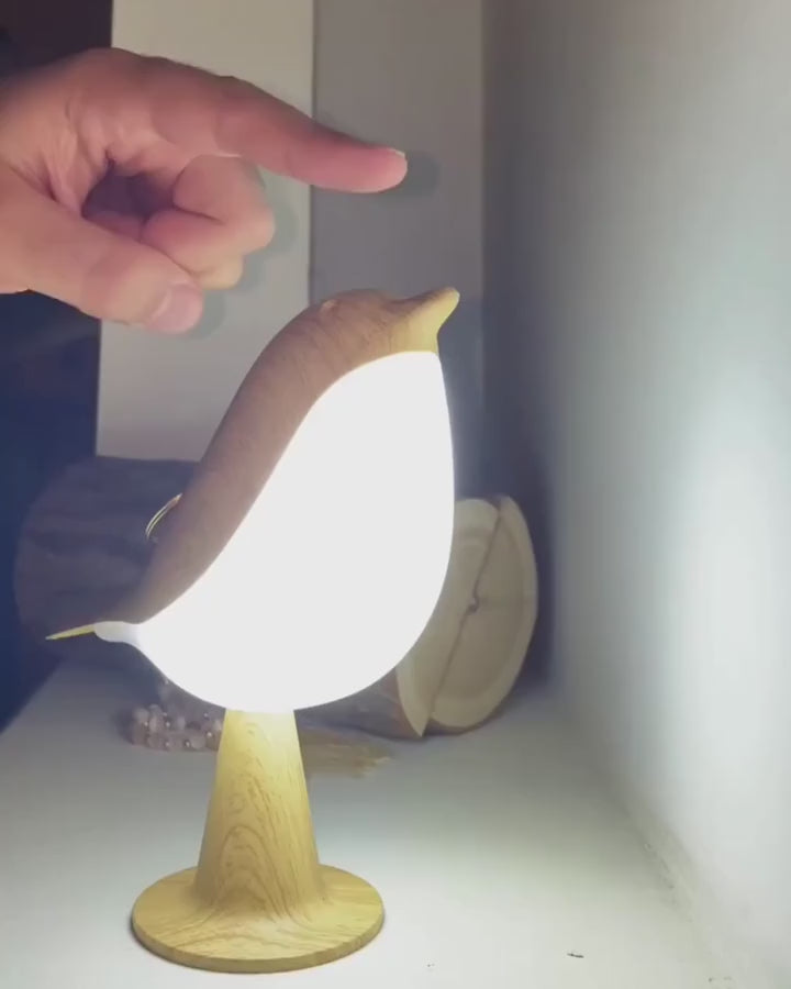 The lamp switches between white and warm light